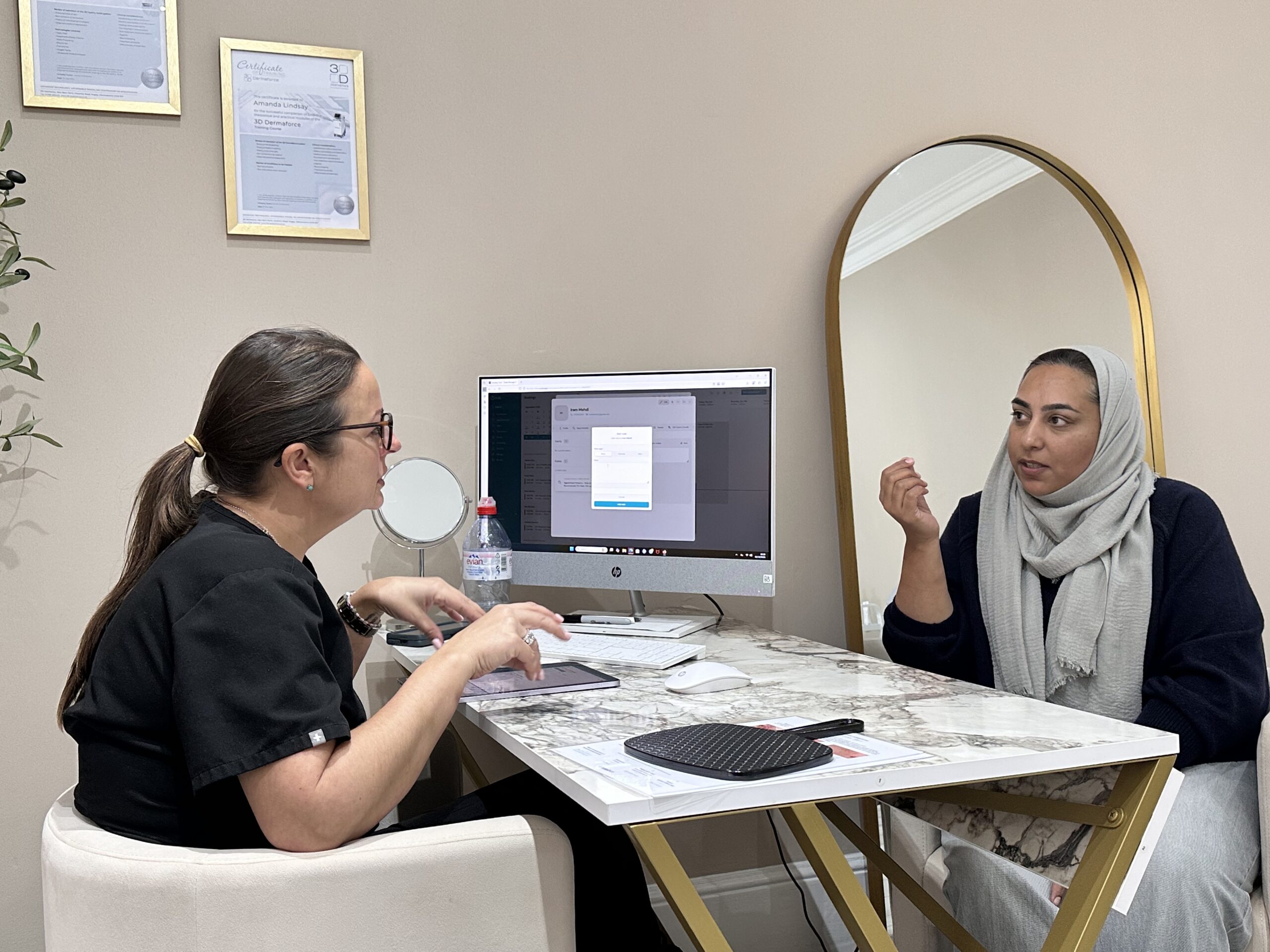 Practitioner assessing a patient during a tailored skin consultation